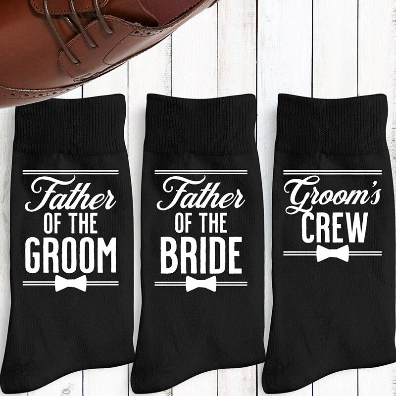 Black father of the groom, father of the bride, and grooms crew socks