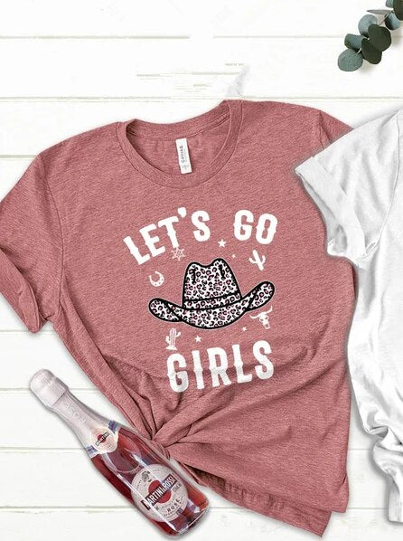 Pink t-shirt with let's go girls written in white and a cowboy hat on the front.